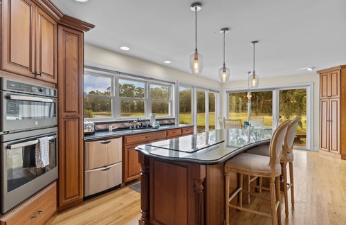 Sea Trail Casa | Gorgeous waterfront home with private hot tub, pool, views, deck, & fireplace
