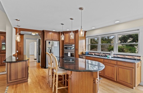 Sea Trail Casa | Gorgeous waterfront home with private hot tub, pool, views, deck, & fireplace