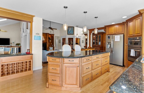 Sea Trail Casa | Gorgeous waterfront home with private hot tub, pool, views, deck, & fireplace