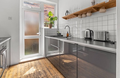 William Morris Apartamento | GuestReady - A beautiful home with garden