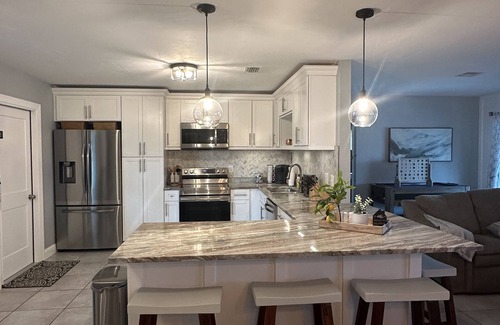 Pelican Casa | Gulf access pet friendly waterfront oasis with NEW heated salt water pool & spa