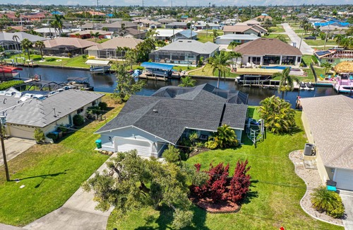 Pelican Casa | Gulf access pet friendly waterfront oasis with NEW heated salt water pool & spa