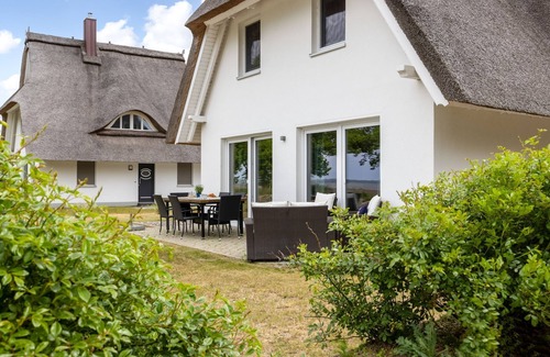 Am Salzhaff Cabaña | Haus Heimathafen with fireplace, sauna and sea view, OFC 35 - Haus Heimathafen with