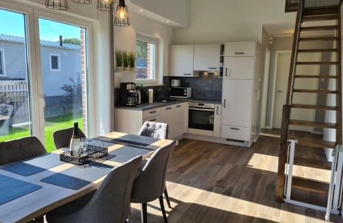 Sehestedt Casa | Haus KüstenBrise - Urlaub mit Hund an der Küste mit eigenen Garten, Sauna und gemütlichen Kaminfeuer