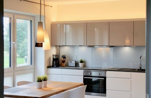 Dangast Apartamento | Este moderno apartamento nórdico premium "Nordbudje" para 4 personas rocía e