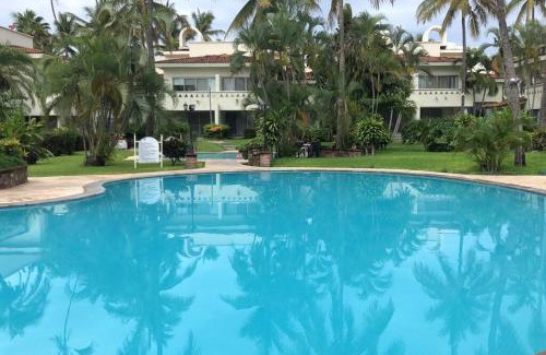 Olas Altas Apartamento | Hermoso apartamento en Manzanillo con alberca y cancha de tenis, Ideal para relajarse y disfrutar de una escapada tranquila en el paraíso tropical