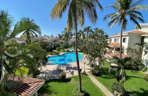 Olas Altas Apartamento | Hermoso apartamento en Manzanillo con alberca y cancha de tenis, Ideal para relajarse y disfrutar de una escapada tranquila en el paraíso tropical