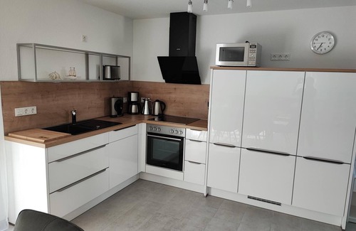 Hilgenriedersiel Casa | High-quality 100sqm vacation home for 6 people with fireplace and garden directly on the dike