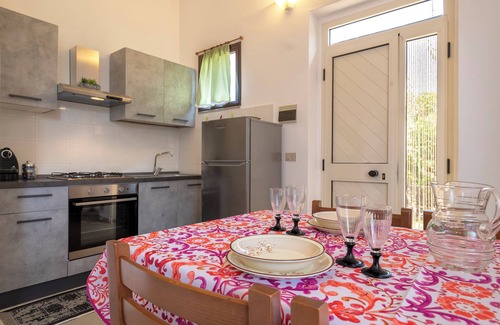 Trinita d'Agultu e Vignola Casa | Holiday Home 'Rose's House' with Lateral Sea View, Private Terrace and Private Garden
