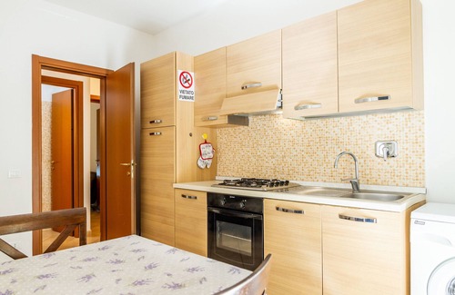 Follonica Apartamento | Apartamento vacacional "Acqua" con vistas al mar y jardín privado