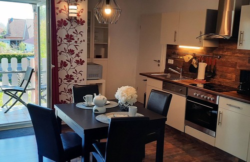 Langballig Apartamento | Apartamento vacacional "Wikingerland Typ 2 Obergeschoss" con balcón, jardín compartido y Wi-Fi