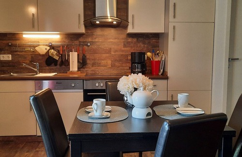 Langballig Apartamento | Apartamento vacacional "Wikingerland Typ 2 Obergeschoss" con balcón, jardín compartido y Wi-Fi