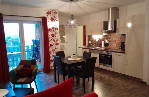 Langballig Apartamento | Apartamento vacacional "Wikingerland Typ 2 Obergeschoss" con balcón, jardín compartido y Wi-Fi