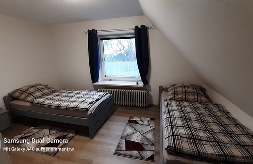 Großheide Casa | Holiday home at the marriage -upper apartment-