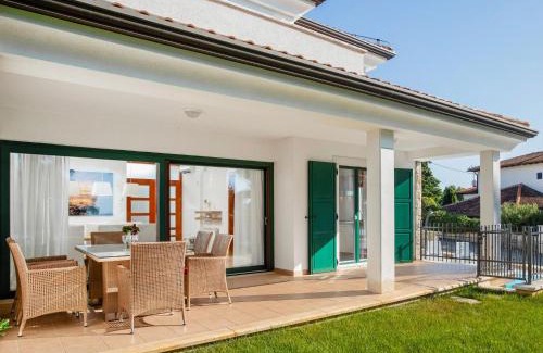 Basanija Casa | Holiday Home Villa Beach Front by Interhome