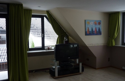 Neuharlingersiel Apartamento | FEWO1 para familias, también con un perro, vista del dique y un corto paseo a la playa