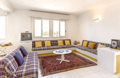 Punta Braccetto Apartamento | Homerez - ¡A 40 m de la playa! Apartamento para 4 pers. en Punta Braccetto