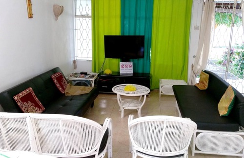 Pointe aux Biches Casa | Homerez - Casa para 7 pers. con piscina compartida y jardín en Trou-aux-Biches
