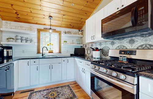 Manchester Casa | Idyllic & sunny lakefront home with large patio & views - near golf & skiing