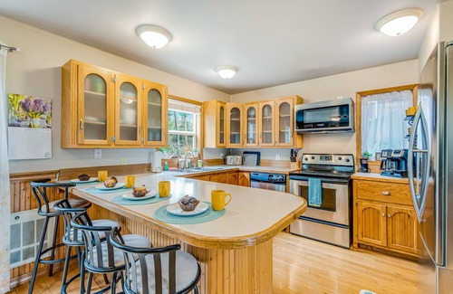 Camano Island Casa | Idyllic woodsy retreat with firepit, two kitchens, Port Susan views & woodstoves
