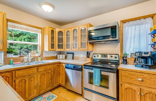 Camano Island Casa | Idyllic woodsy retreat with firepit, two kitchens, Port Susan views & woodstoves