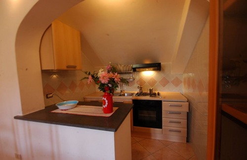 Tramonti Casa | Il Libeccio A3 Apartamento de 2 dormitorios con acceso al jardín y a la piscina.