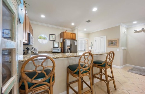 Indigo Reef Marina Homes Casa | Indigo Reef Resort Waterfront Villa 25 With Boat Dockage, Pool, and Sunset-View