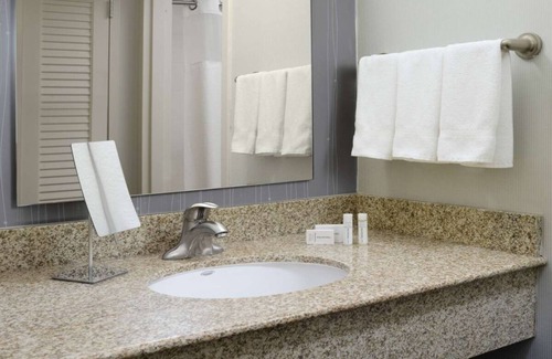 North Dallas Hotel | Indulge in Home-Like Comfort! Outdoor Pool, Pet-friendly and Free Parking!