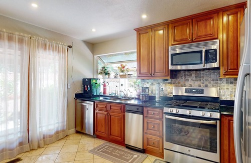Fremont Casa | Inviting home with pool, fitness area, fireplace, & W/D