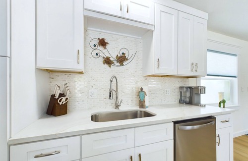 Surfside Estates Casa | Island Oasis with Heated Pool, Putt Putt Course, Tiki Bar, and Beach Gear!