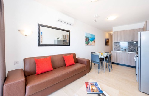 Bugibba Apartamento | Islet Promenade Seafront 1 Bedroom Apartment with 2 seaview balconies