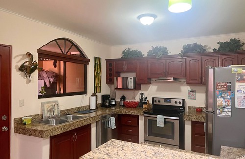 Cerro Plano Casa | Jaco Hideaway: 1 minute walk to direct beach access. Gated community with pool.
