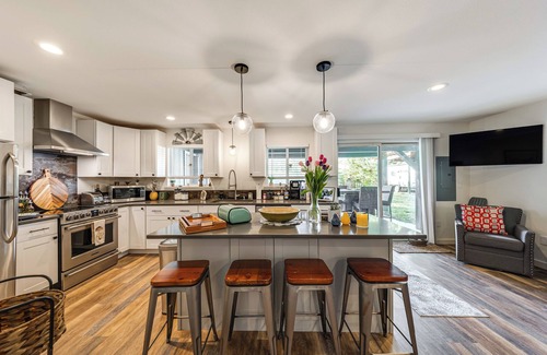 Concrete Casa | Jay's Salmon Run Retreat Breathtaking Riverfront Views-Hot Tub, Firepit, Pinball