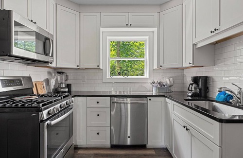 Lakeside Casa | Juniper Presents: A Classic Lakeside Cottage w/ Hot Tub, Steps from the Beach