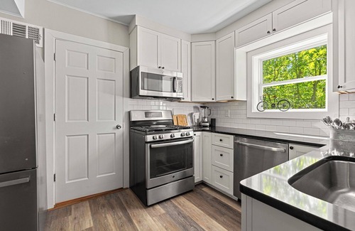 Lakeside Casa | Juniper Presents: A Classic Lakeside Cottage w/ Hot Tub, Steps from the Beach
