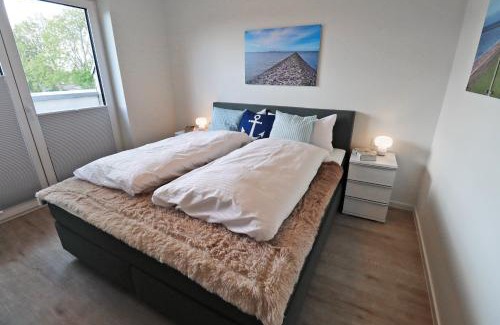 Tossens Apartamento | KÜSTE33/48 – Penthousewohnung mit Dachterrasse, Sauna - strandnah!