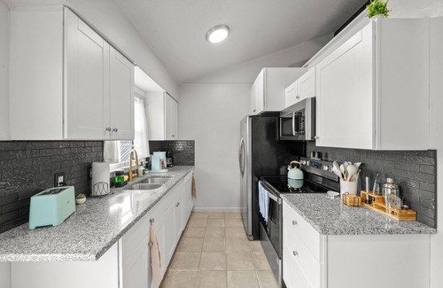 Shawnee Casa | Kansas Escape with Movie Room, Hot Tub, Mini Golf, Pickleball, Game Room & more!