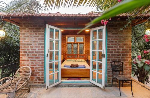 Bengaluru Casa | Kerala Style Villa by JadeCapsAC4BHKFishpond