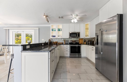 Bay Point Casa | Key West Beach House with heated pool, tiki, and dock.♿︎