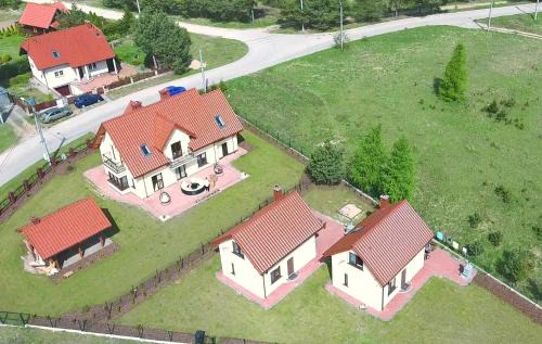 Kruklanki Apartamento | Komfortowe domki letniskowe nad jeziorem na Mazurach 2