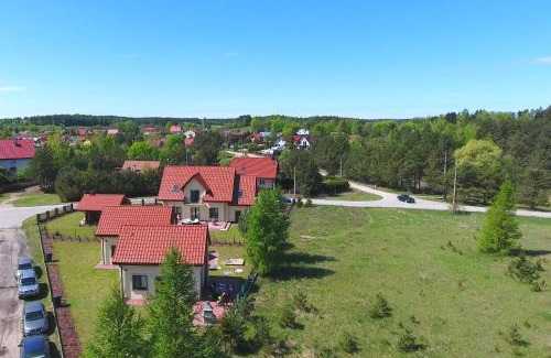 Kruklanki Apartamento | Komfortowe domki letniskowe nad jeziorem na Mazurach 2