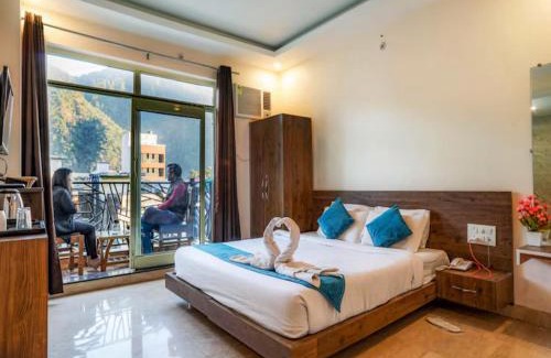 Tapovan Hotel | LA Riqueza Pride Inn # Customer's Favourite Hotel in Tapovan #Free use of Swimming Pool & Gym # Mountain View Rooms # Close to Lakshman Jhula # Free Parking