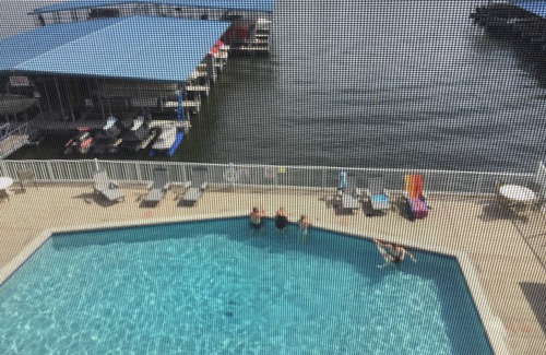 Sunrise Beach Condominio | Lake Lodge Condo overlooking The swimming pool and the￼ Lake of the Ozarks