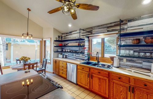 Greeley Casa | Lake-view home with gas fireplaces, inviting deck & dog-friendly yard