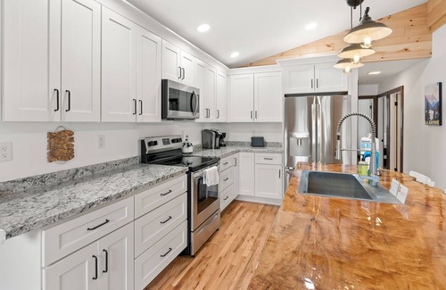 Silver Bay Casa | Lake-view home with large deck, grill, lawn, & mtn views - dog-friendly