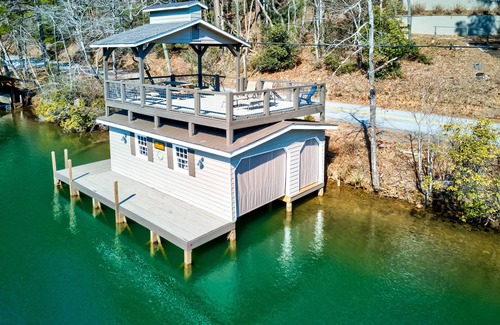 Lakemont Casa | Lakefront gem with deck, grill, boathouse/dock, fireplace, central AC, &WiFi