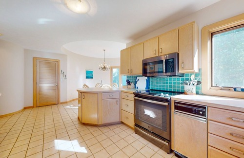 Charlevoix Casa | Lakefront home on Oyster Bay w/ private dock, beach, fire pit, & hammock