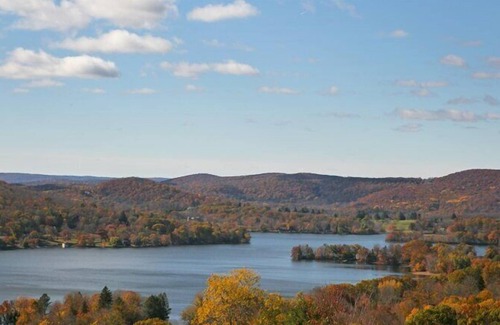 New Preston Casa | Lakefront Home set on five acres of land, deck, patio, lounge seating by...