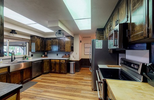 Bass Lake Casa | Lakefront home w/private boat dock, hot tub, gas grill, buoy, & wood fireplace