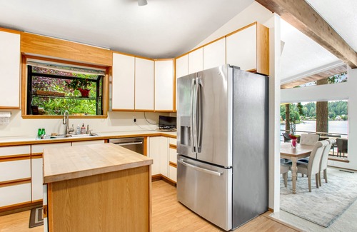 East Olympia Casa | Lakefront home with private dock, paddleboat, fast WiFi, deck, grill & W/D
